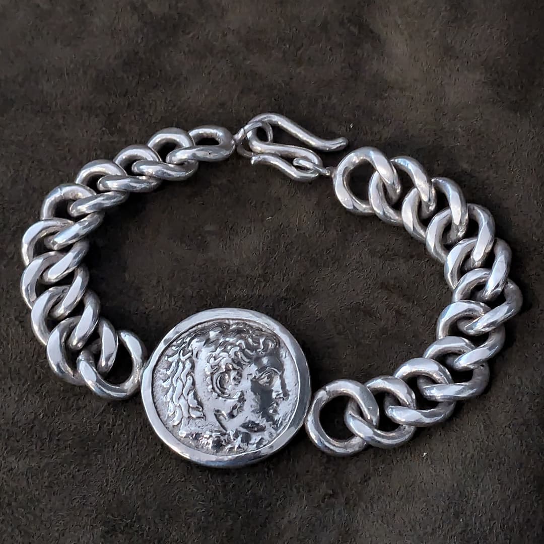 Alexander the Great tetradrachm coin set into a bezel with a Cuban link chain to form a bracelet