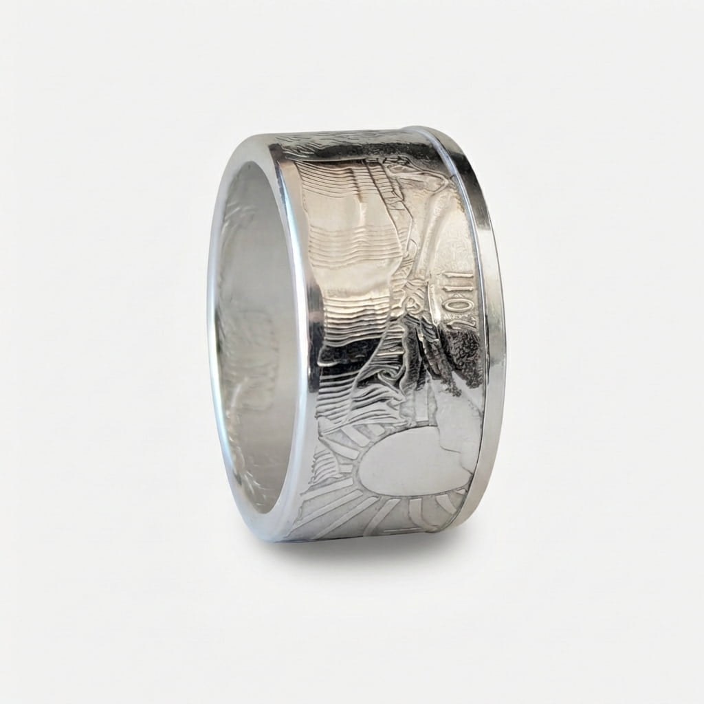 Polished American Silver Eagle coin ring standing on edge with the date out.