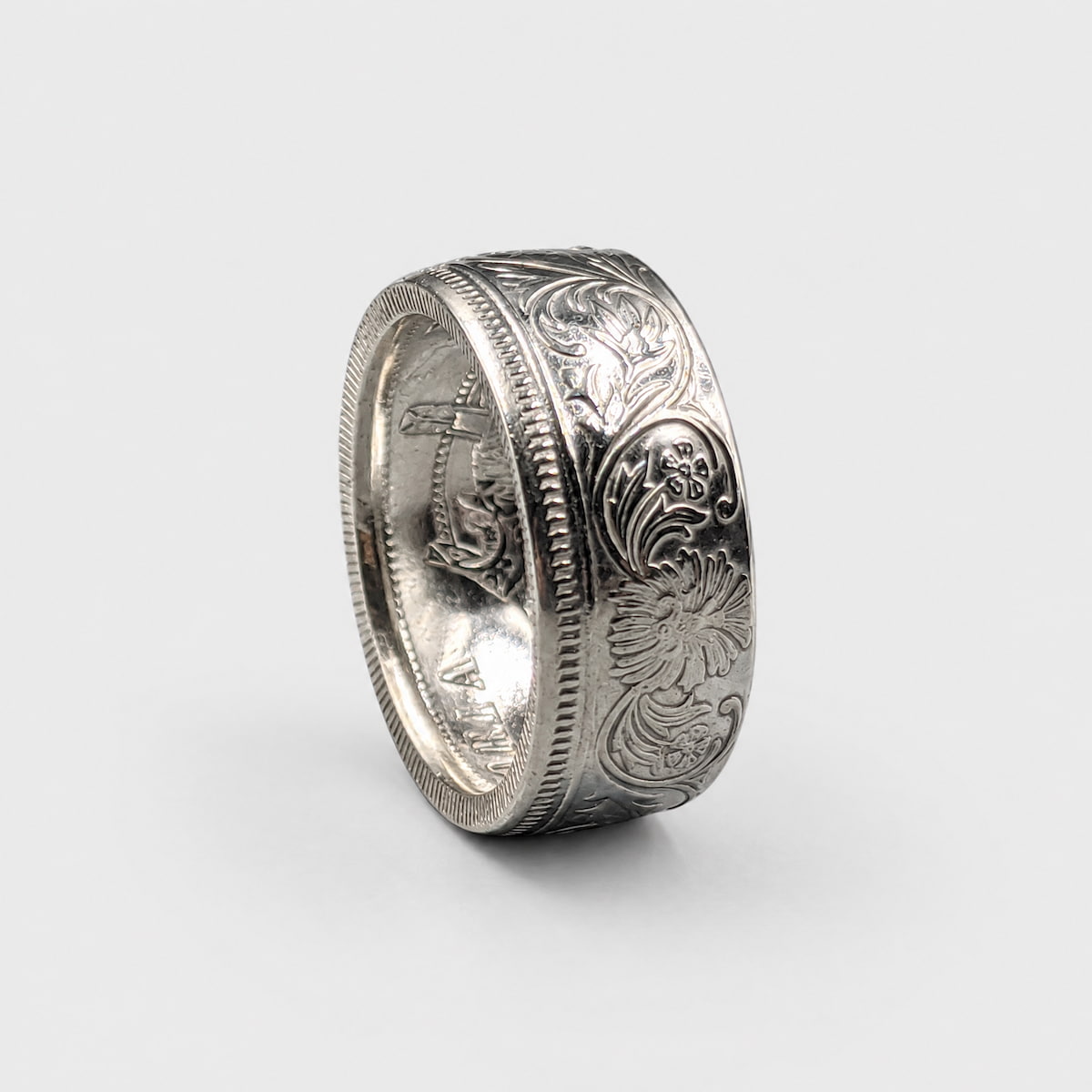 Indian 1 rupee silver coin ring standing on edge with a polished finish from Silver State Foundry