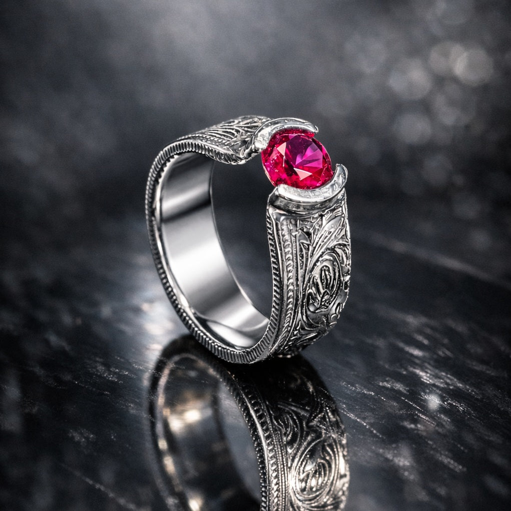 Vintage indian rupee silver coin with a tension-set ruby gemstone on a black background