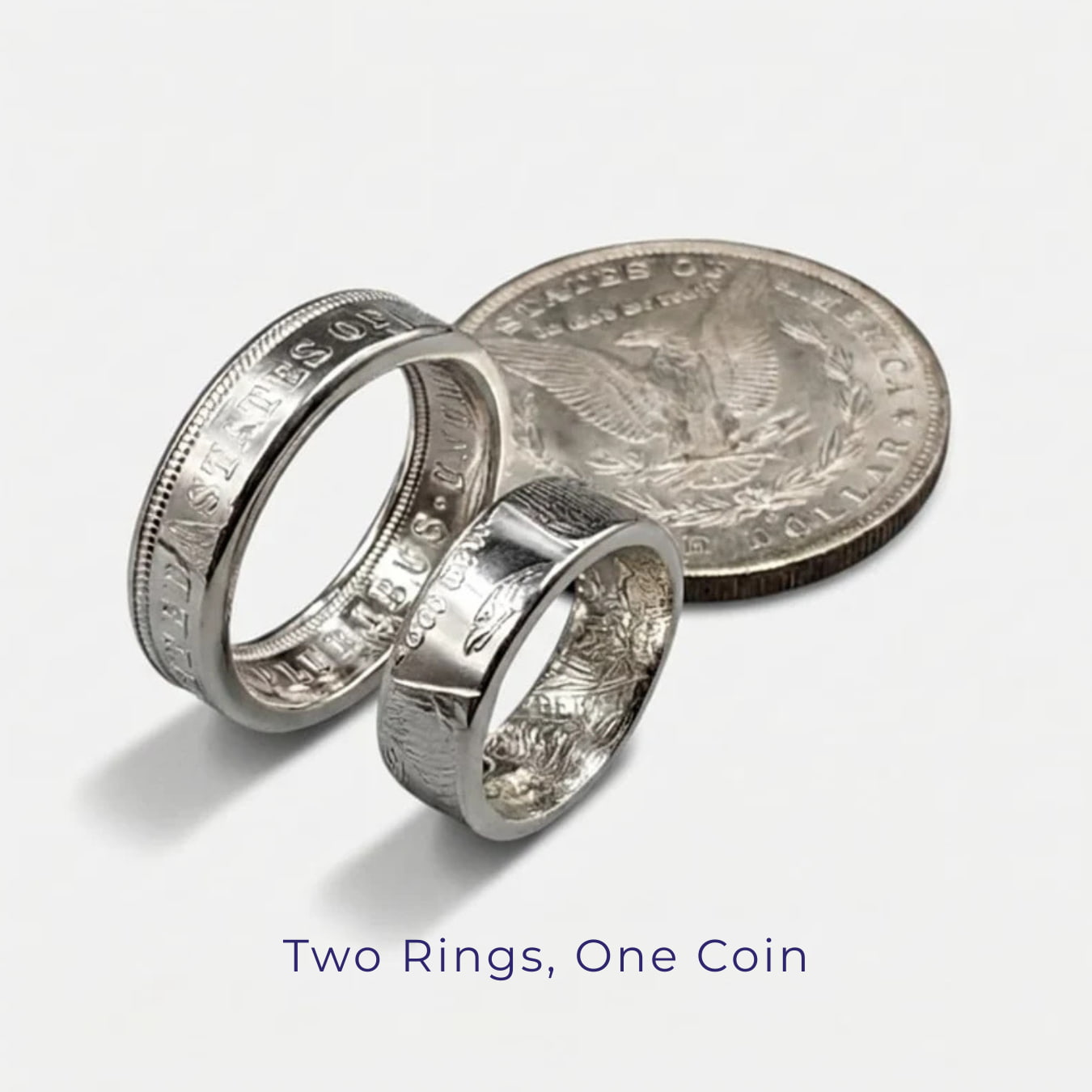 The Morgan Silver Dollar wedding set - two rings form one Morgan Silver Dollar Coin - standing upright on a white background next to a Morgan Silver Dollar coin.
