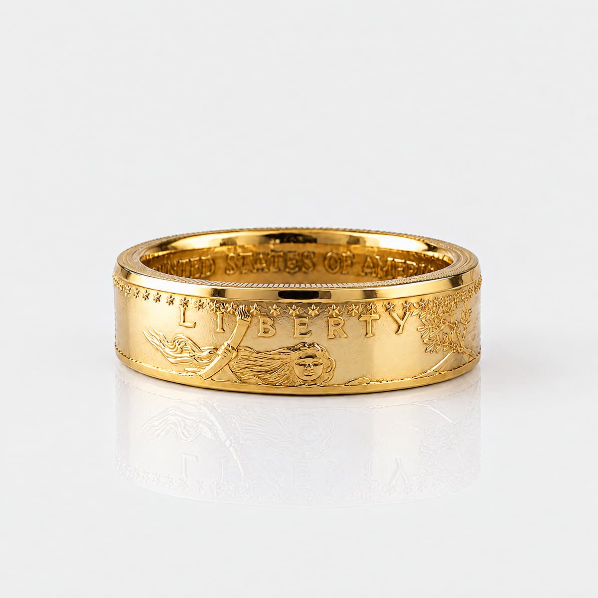 Gold coin ring forged from a half ounce American Gold Eagle coin, laying flat on a white background.