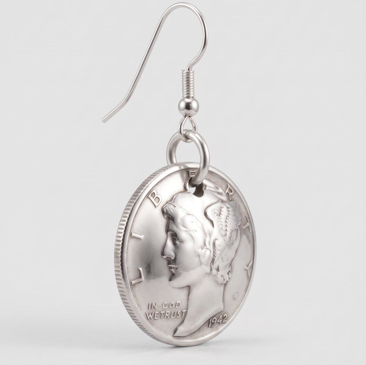 Mercury Dime earring at 65 degree angle to show the domed effect, on a white background