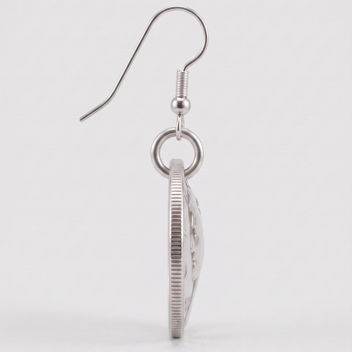 side view of a Mercury Dime earring, clearly showing the domed effect