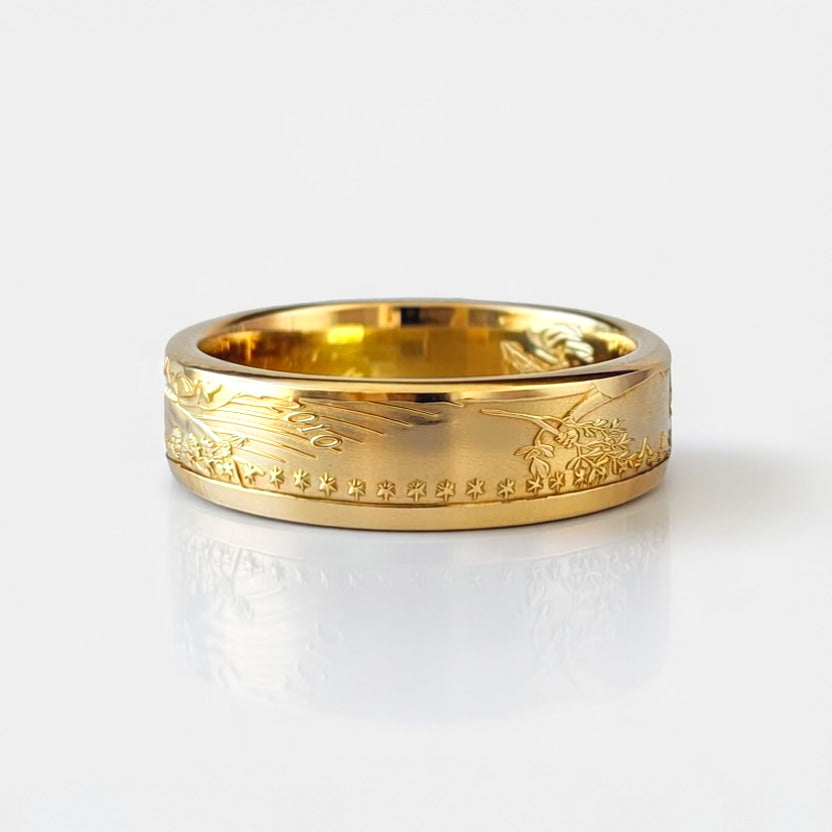American Gold Eagle coin ring made from a quarter ounce gold coin, laying flat and showing the date.