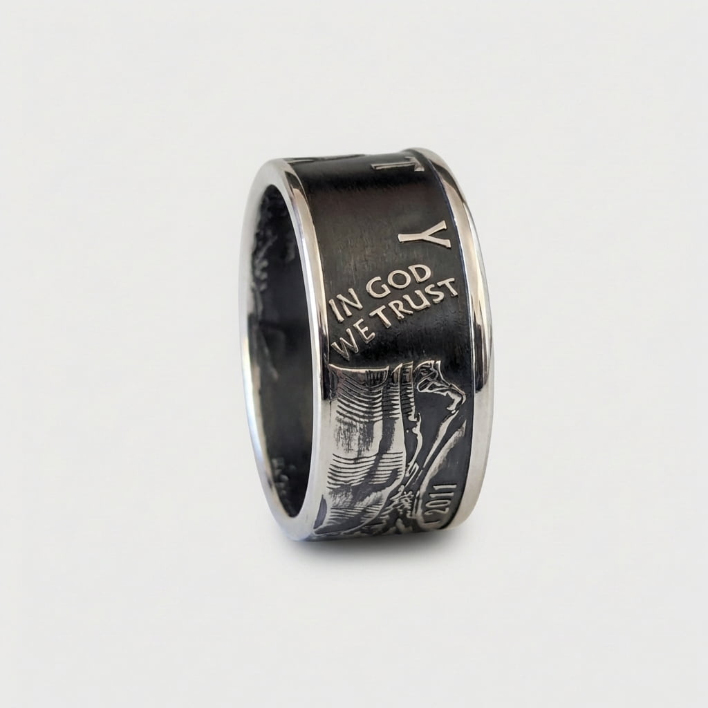 Patina finished American Silver Eagle coin ring standing on edge with In God We Trust showing.