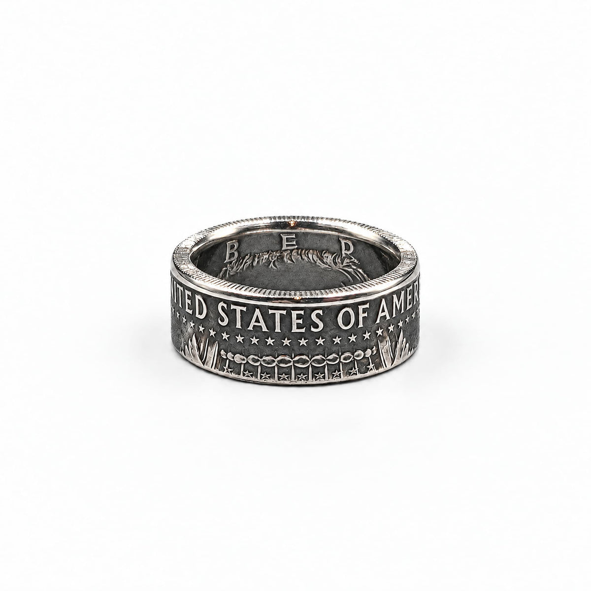 JFK half dollar coin ring with a patina finish from Silver State Foundry