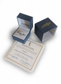 Blue jewelry box with a ring and certificate on a white background