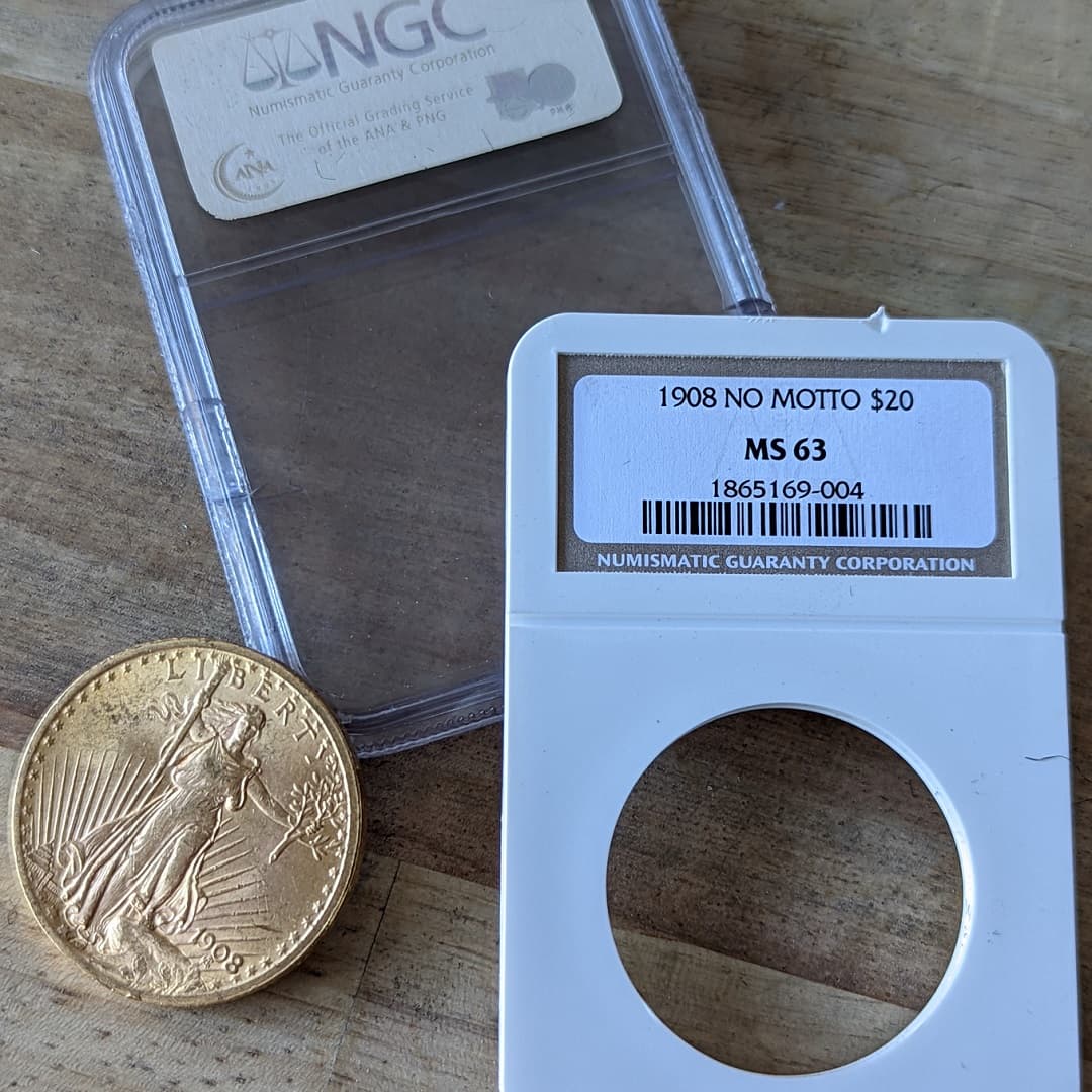 Pre-1933 Saint Gaudens Gold Eagle coin laying next to the NGC case that proves authenticity.