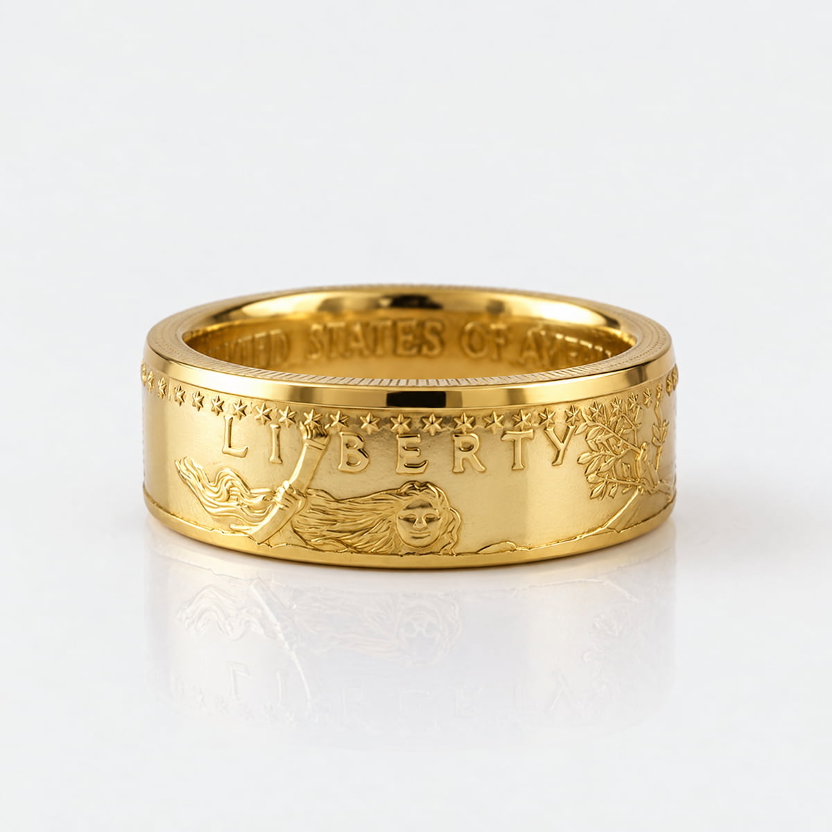 Gold coin ring forged from a full ounce American Gold Eagle coin, laying flat on a white background.