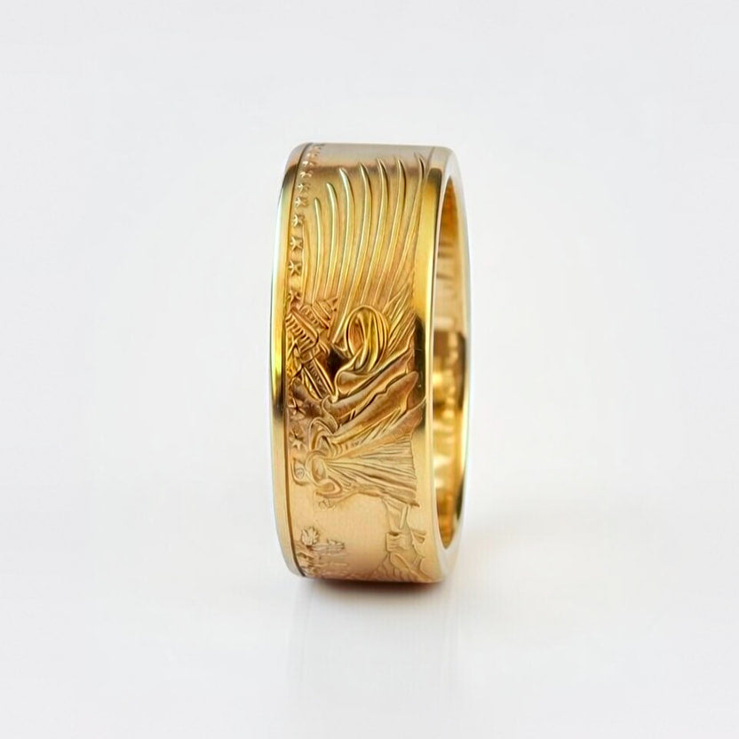 Gold coin ring forged from a half ounce American Gold Eagle coin, standing on edge and showing the Capitol Building detail on a white background.
