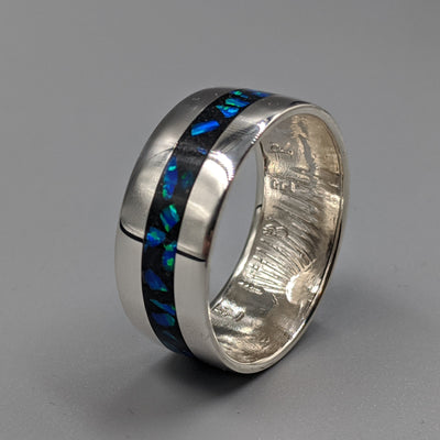 inlay of cremation ash in a coin ring