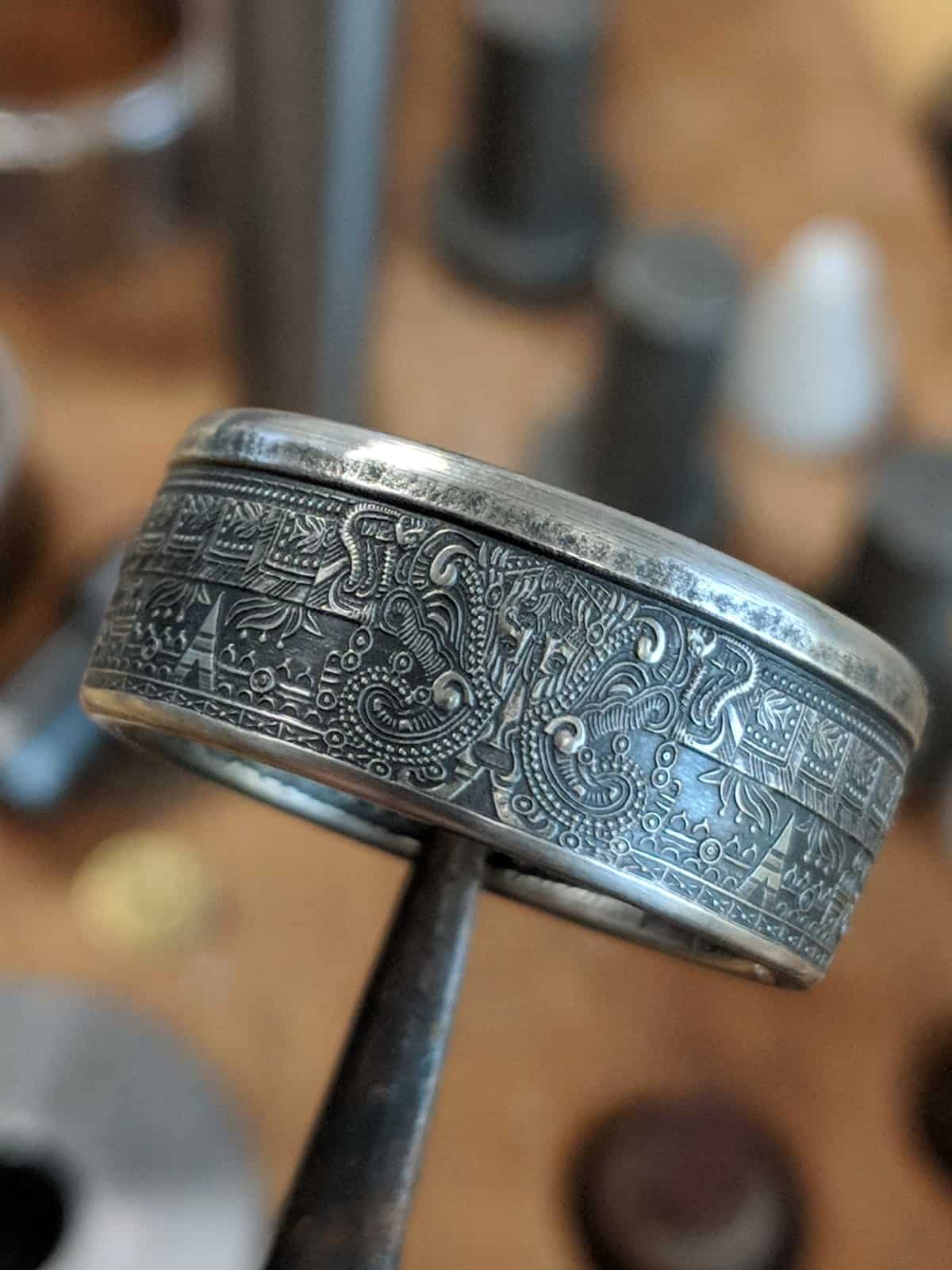 Aztec calendar coin ring with rich patina