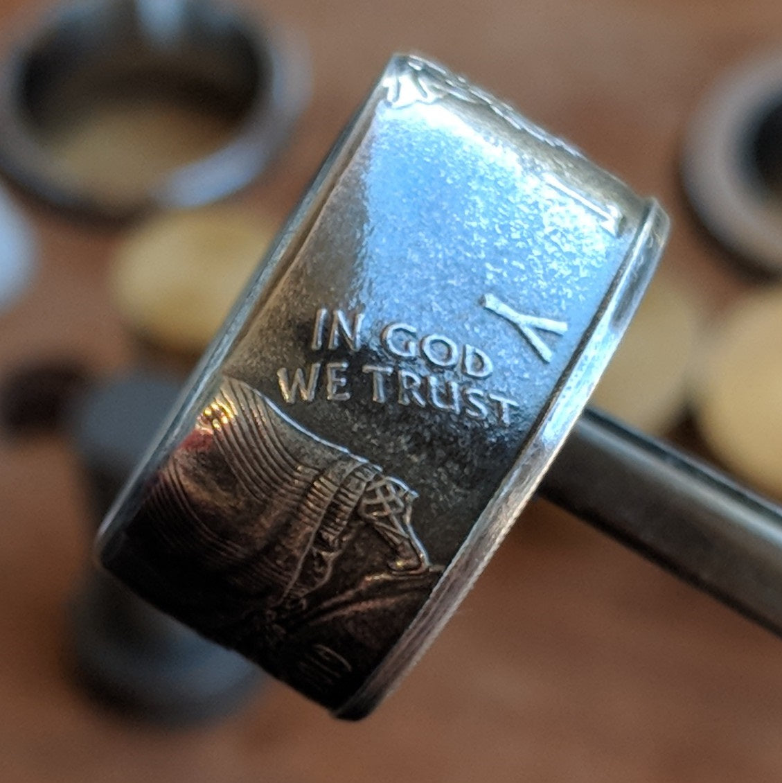 Silver Eagle coin ring showing In God We Trust on the outside band.
