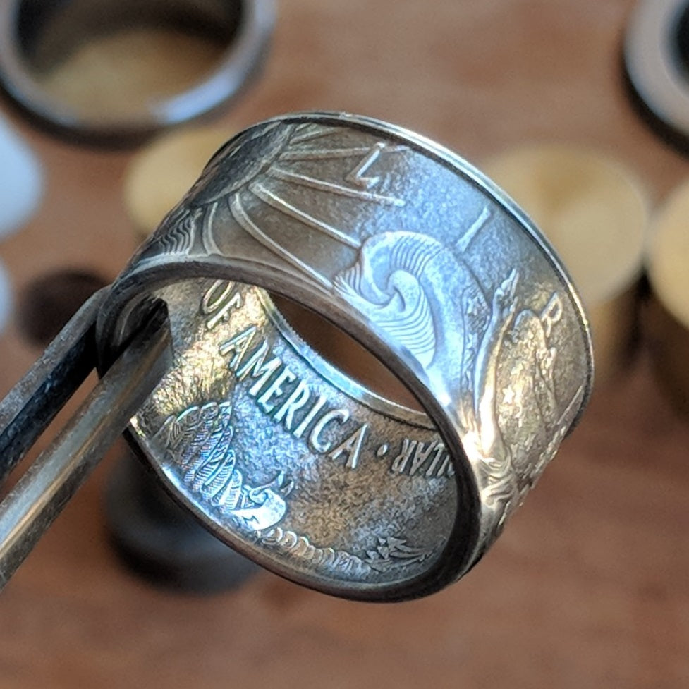 Silver Eagle coin ring with the Rising Sun and 'Liberty' displayed on the outside.