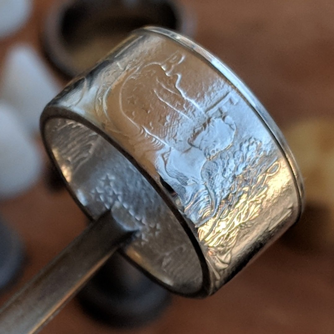 Polished American Silver Eagle coin ring made from a customer's coin